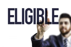 man pointing to the word "ELIGIBLE"