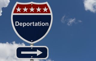 deportation road sign with background clouds