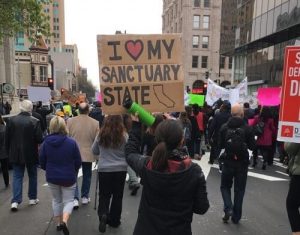 sanctuary state protest sign