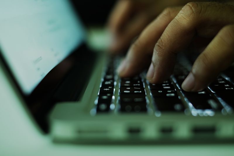 typing on laptop closeup