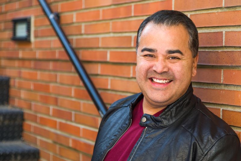 smiling middle aged hispanic man